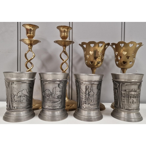 457 - A mixed lot of contemporary items. To include two pairs of candleholders & a set of four pewter tank... 