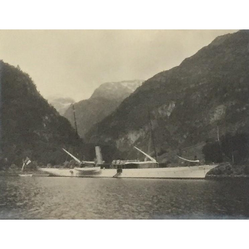 1118 - A framed picture of a research vessel at Hyen, Nordfjord in 1912, together with two military books.