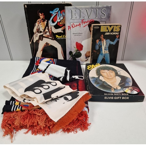 1539 - A collection of Elvis Presley memorabilia. To includ ebooks, gift box, banners, towel etc.