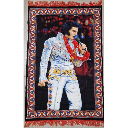 1539 - A collection of Elvis Presley memorabilia. To includ ebooks, gift box, banners, towel etc.