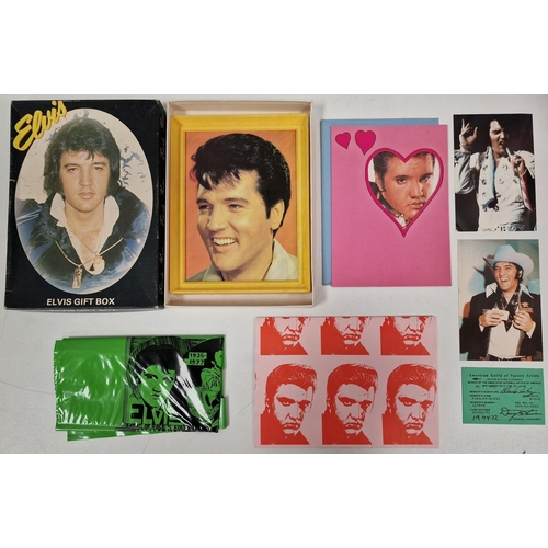 1539 - A collection of Elvis Presley memorabilia. To includ ebooks, gift box, banners, towel etc.