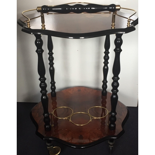 2 - A vintage Italian Bar Cart. Two lacquered tiers, with brass fittings/castors & ebonised supports. Di... 