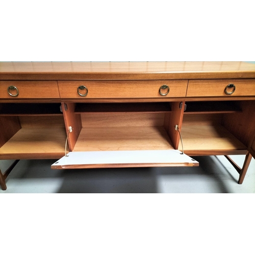 8 - A stunning, mid-century 'Nathan' teak, long sideboard. Features a trio of drawers (including cutlery... 