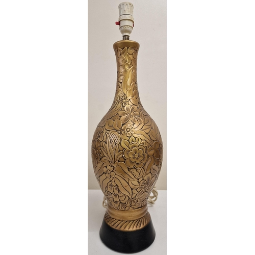 61 - A vintage table lamp, with a gold-coloured floral design. Complete with shade. PAT test pass & funct... 