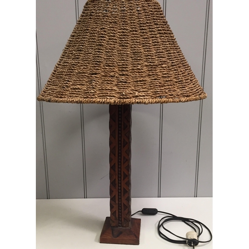 62 - A pair of mid-century, carved wooden table lamps, with rattan shades (differently shaped). Will requ... 