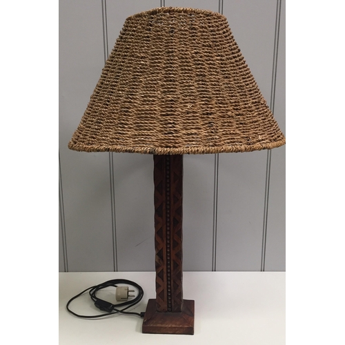 62 - A pair of mid-century, carved wooden table lamps, with rattan shades (differently shaped). Will requ... 