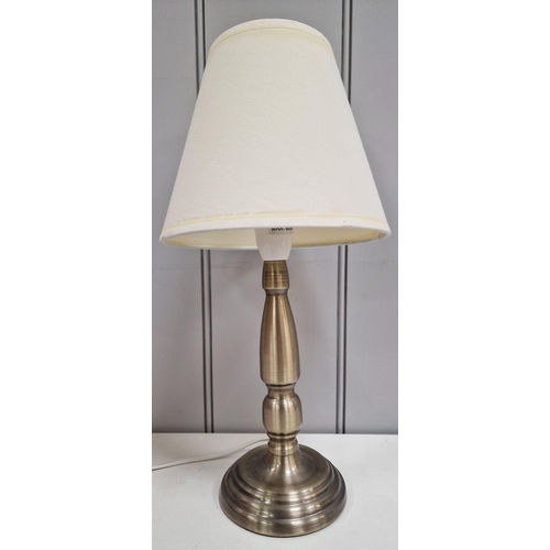 77 - A Dunelm table lamp. Height 38cm, diameter 28cm. PAT test pass & functionality test indicates in wor... 