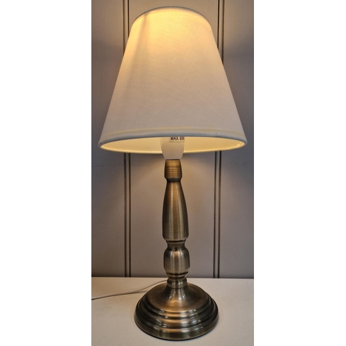 77 - A Dunelm table lamp. Height 38cm, diameter 28cm. PAT test pass & functionality test indicates in wor... 