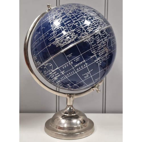 93 - A contemporary blue coloured globe, supported by a chrome stand. Height 30cm, diameter 18cm.