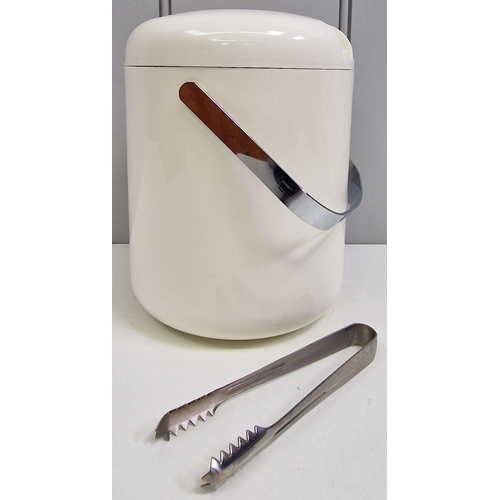 101 - A retro ice bucket, with stainless steel handle & tongs. Height 19cm, diameter 15cm.