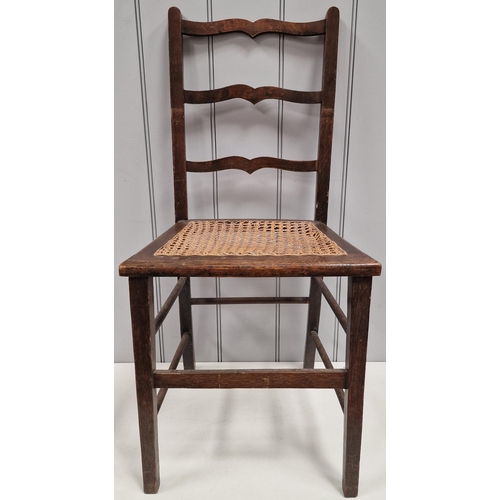 5 - An Edwardian ladder back chair, with woven cane seat. Dimensions(cm) H83(42 to seat), W39, D35.