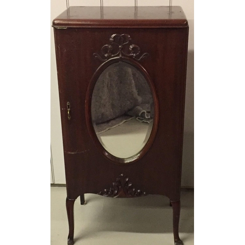 17 - A mahogany sheet music cabinet, with mirrored door detail. Dimensions(cm) H96, W48, D37.