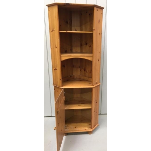 34 - A freestanding, pine corner bookcase/cupboard. Double shelves, over single-shelved cupboard. Dimensi... 