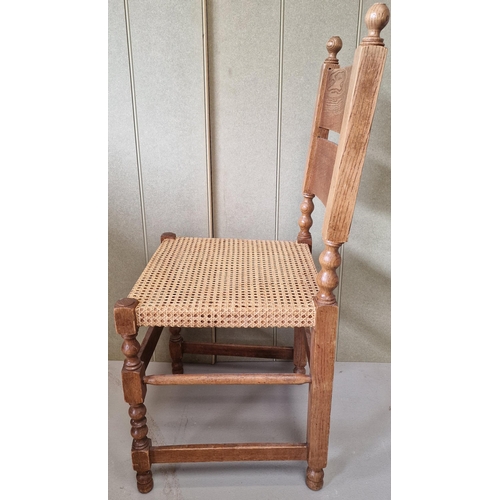44 - An early 20th century oak hall chair, with woven cane seat. Dimensions(cm) H98(48 to seat), W41, D46... 