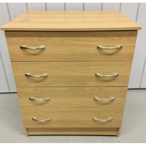 56 - A beech-coloured chest of four drawers with chrome coloured handles, on castors. Dimensions(cm) H85,... 