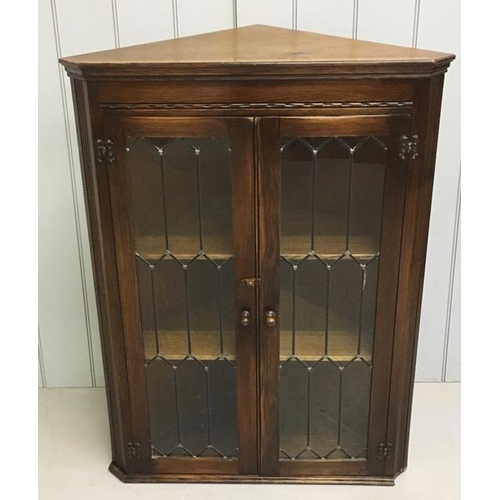58 - An oak, glazed corner display bookcase, by Bevan Funnell. Ltd. Dimensions(cm) H108, W80, D45.