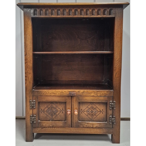 65 - An early 20th century, English oak open bookcase, with carved cupboard area to base. Dimensions(cm) ... 
