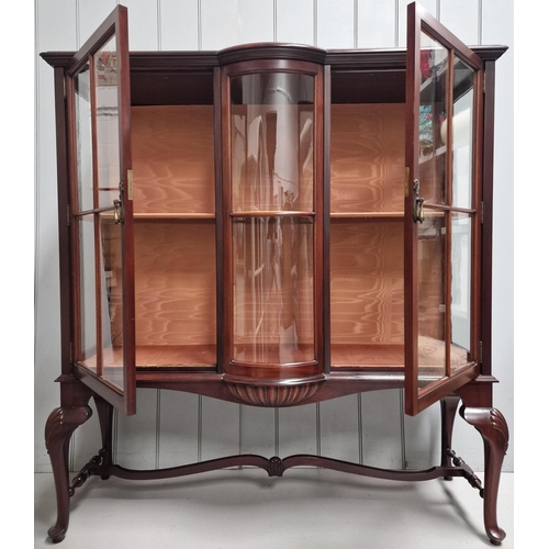 66 - A bow-front display cabinet, with two interior glass shelves. Dimensions(cm) H134, W122, D42.