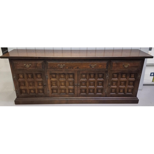 72 - A long, oak sideboard, with three drawers (includes cutlery compartments) & quadruple cupboards, fro... 