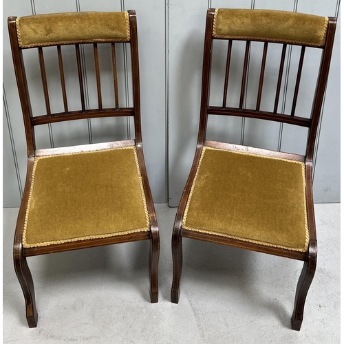 75 - A pair of spindle-backed hall chairs. Dimensions(cm) H87(37 to seat), W42, D54.