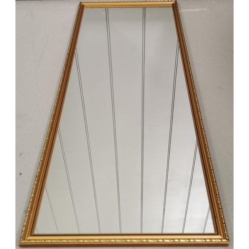 76 - A rectangular full length wall mirror, with wooden, gold-coloured, filigree-effect frame.  Height 92... 
