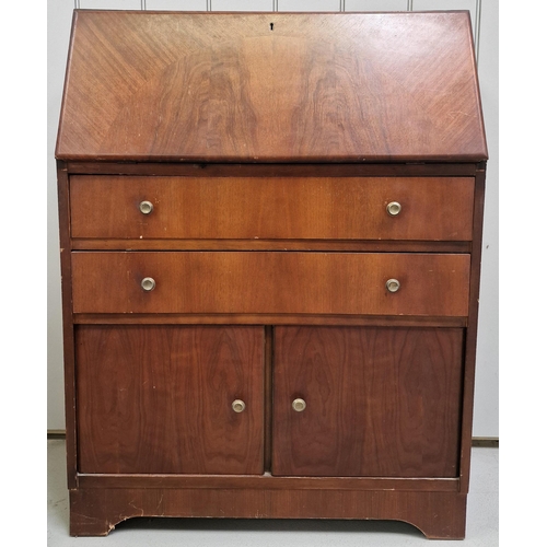 87 - A vintage bureau. Fall-front, over twin drawers & double cupboard area. Dimensions(cm) H100, W75, D3... 