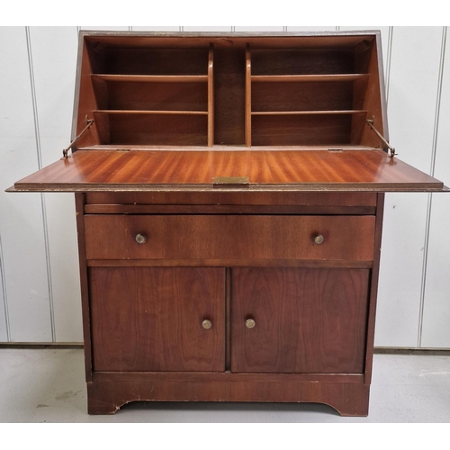 87 - A vintage bureau. Fall-front, over twin drawers & double cupboard area. Dimensions(cm) H100, W75, D3... 
