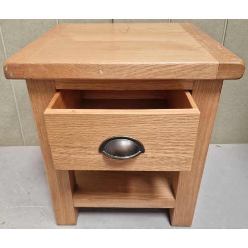 92 - A contemporary, solid oak bedside cabinet. Dimensions(cm) H50, W45, D45.