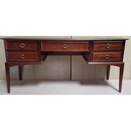 104 - A vintage 'Stag - Minstrel' dressing table, with five drawers. Dimensions(cm) H71, W152, D47.