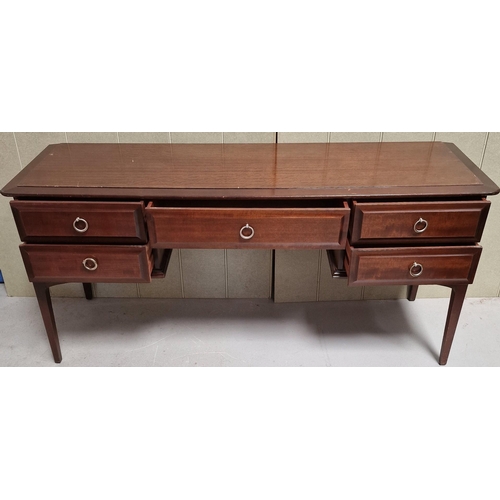 104 - A vintage 'Stag - Minstrel' dressing table, with five drawers. Dimensions(cm) H71, W152, D47.