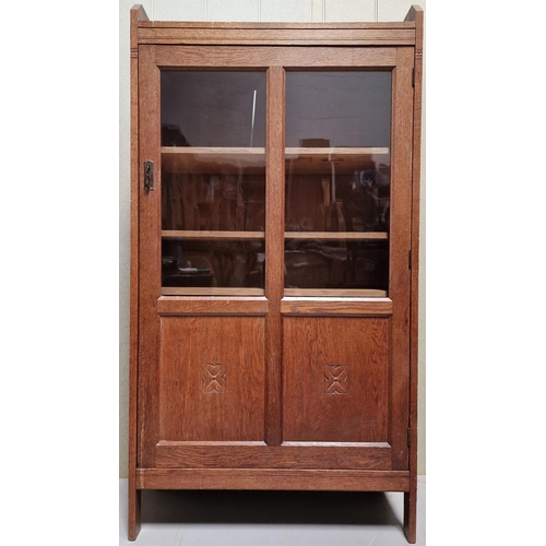 108 - An Art Nouveau oak/part-glazed display cabinet, with four internal adjustable shelves, Key present. ... 