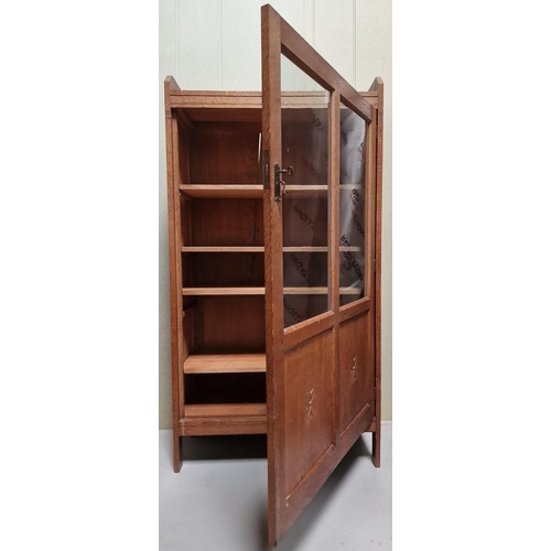 108 - An Art Nouveau oak/part-glazed display cabinet, with four internal adjustable shelves, Key present. ... 