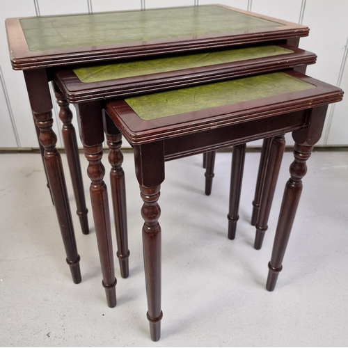 116 - A vintage mahogany nest of three tables, with inset leather tops. Largest dimensions(cm) H51, W55, D... 