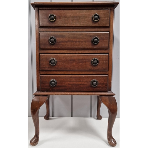 123 - A mahogany bedside chest of drawers or music cabinet, with inset leather top & four drawers, raised ... 