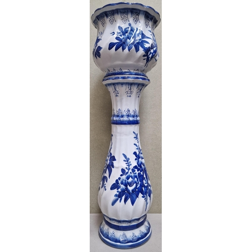 160 - A Delft-style blue & white jardiniere & stand. Dimensions(cm) H90, W28, D28.