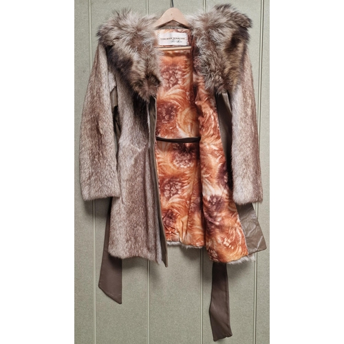 215 - A vintage, mid-length fur coat by 'The Bon Marche Fur Salon'.