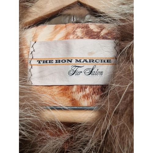 215 - A vintage, mid-length fur coat by 'The Bon Marche Fur Salon'.