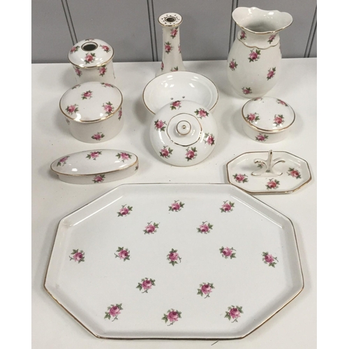 232 - An early 20th century matching wash Set & full bedroom set, in a floral design, by Pountney & Co Ltd... 