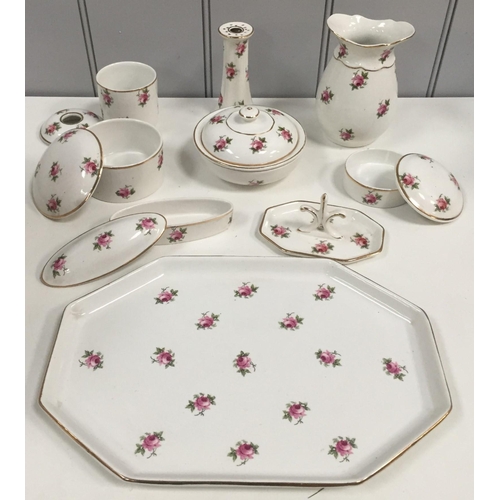 232 - An early 20th century matching wash Set & full bedroom set, in a floral design, by Pountney & Co Ltd... 