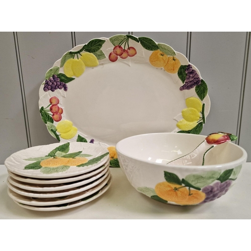 237 - A collection of fruity ceramic tableware. To include platter, six plates, serving bowl & spoon.