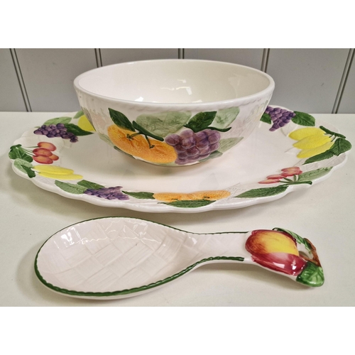 237 - A collection of fruity ceramic tableware. To include platter, six plates, serving bowl & spoon.