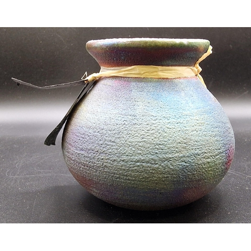 241 - A Jeremy Diller 'Earth & Fire' Raku, Pottery Kokopelli vase/pot. Appears unused. Height 8cm.