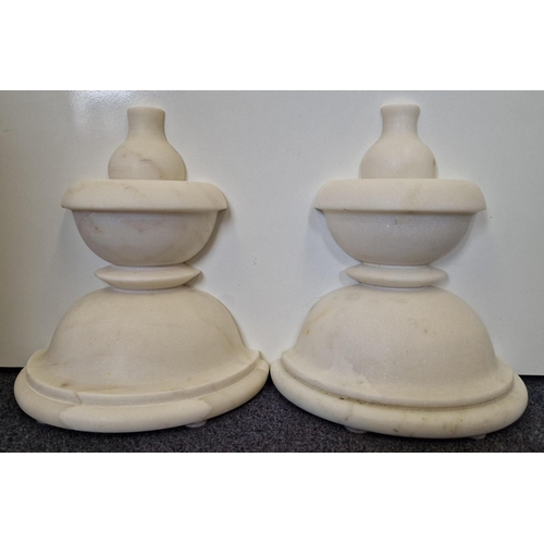 245 - A pair of chess-piece, marble bookends. Height 25cm, diameter 22cm.