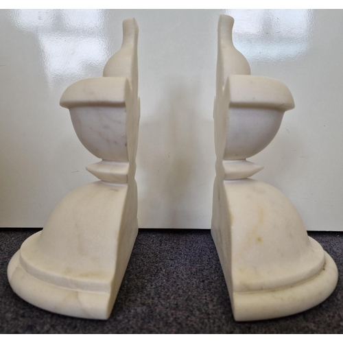 245 - A pair of chess-piece, marble bookends. Height 25cm, diameter 22cm.