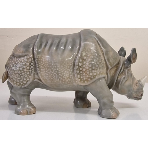 249 - A (likely) Continental porcelain Rhinoceros figure, from early 20th century. Dimensions(cm) H13, L24... 