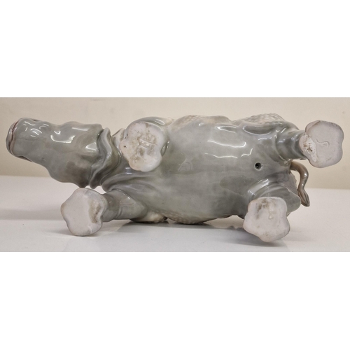 249 - A (likely) Continental porcelain Rhinoceros figure, from early 20th century. Dimensions(cm) H13, L24... 