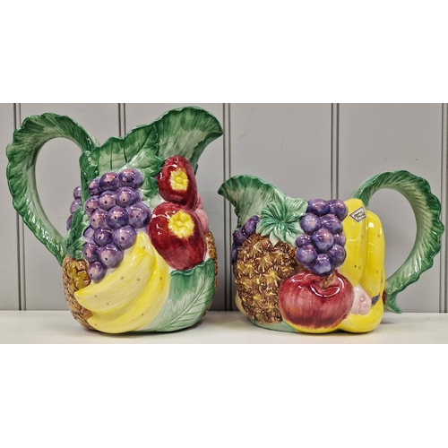 267 - A striking pair of 1980's fruit pitchers, by Fitz & Floyd. Dimensions(cm) H18/24, W25/25, D17/16.