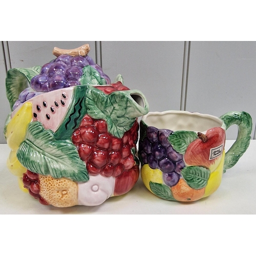 268 - A trio of striking 1980's fruit ceramics, by Fitz & Floyd. To include cake stand, teapot & mug.