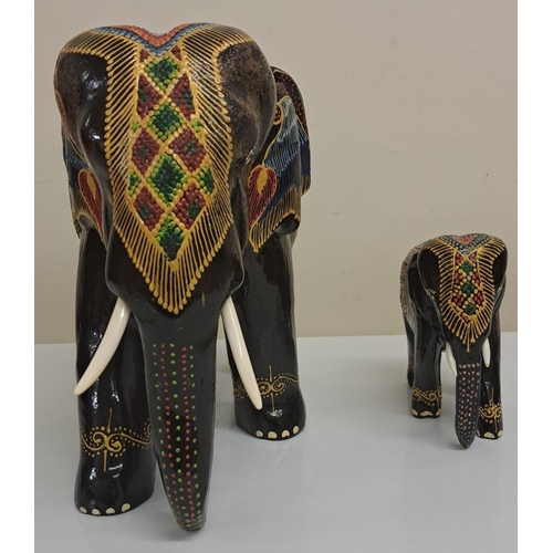 271 - A pair of large/small ceramic elephants, from Thailand. Heights 28cm & 15cm.