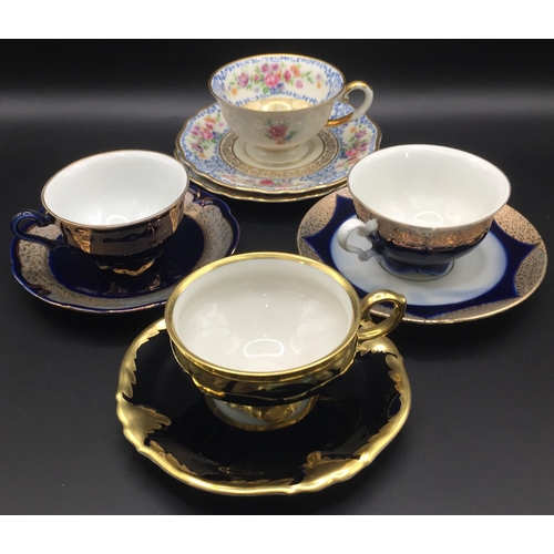 292 - A collection of four German porcelain, display cups & saucer sets.